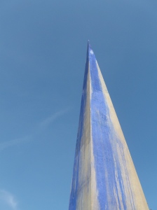 Concrete needle with blue paint.